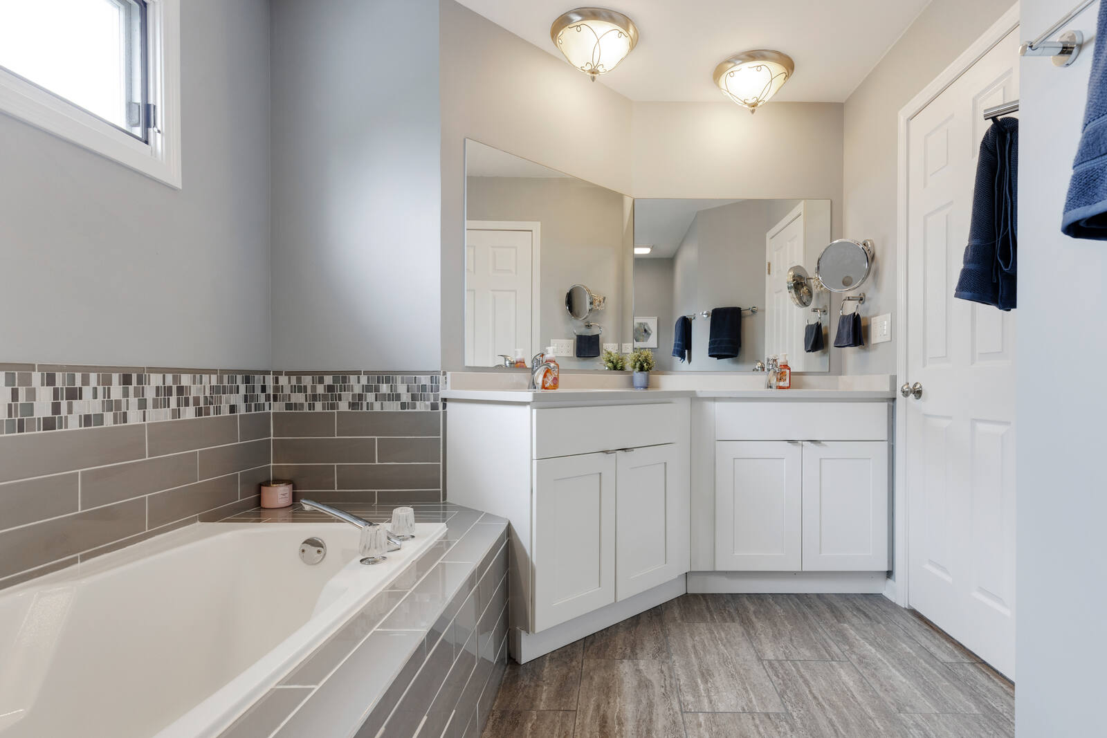 Primary bath with soaking tub and dual vanities